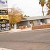 Two foreclosed and unoccupied homes in the 4500 block of East Sun Valley Drive sit across from each other Dec. 15, 2011. 